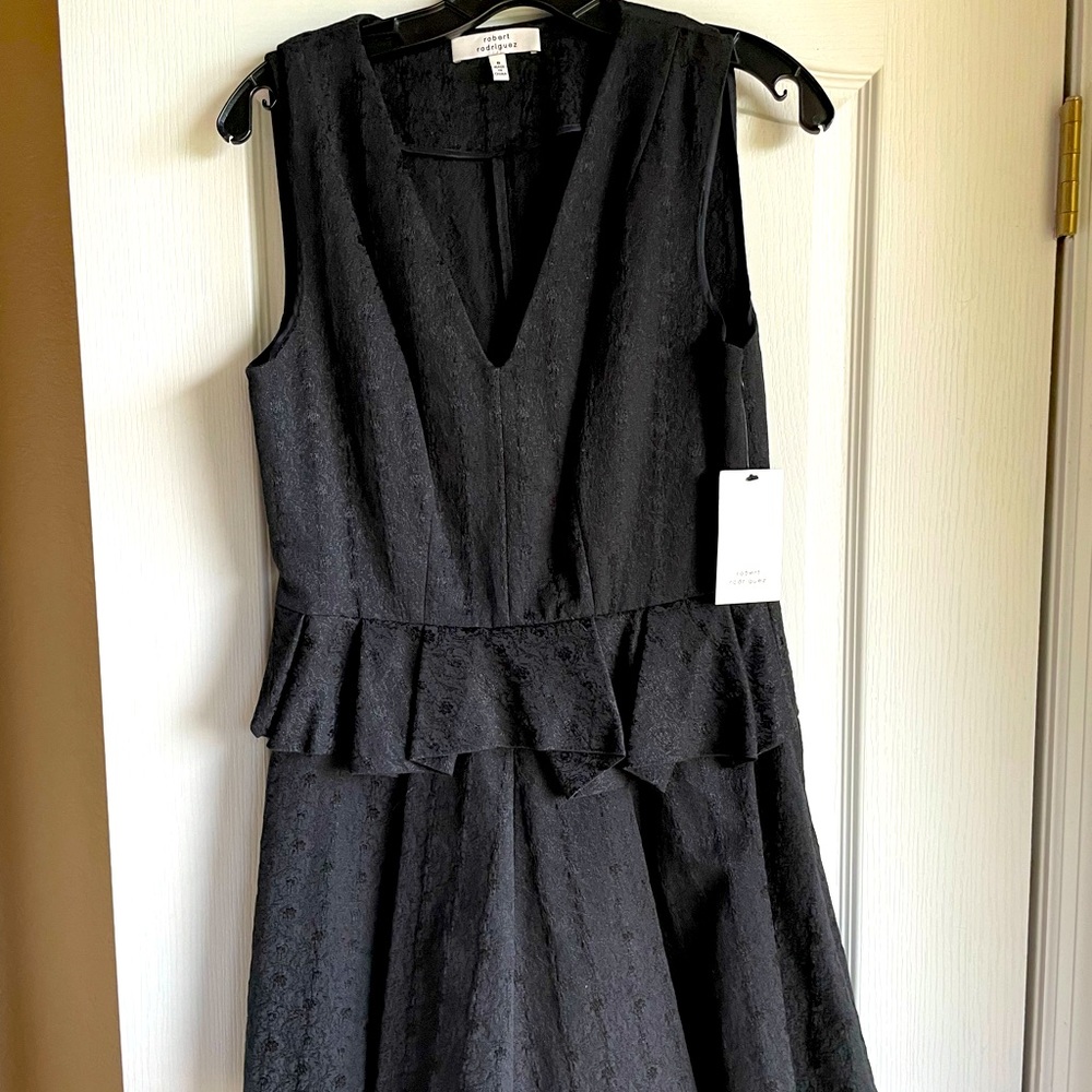 SOLD
Designer Black jacquard fabric textured Mini dress. Size 8